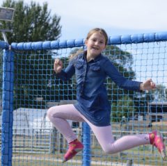 girl jumping on trampoline