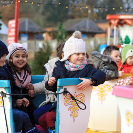 Children having fun on a fun fair ride